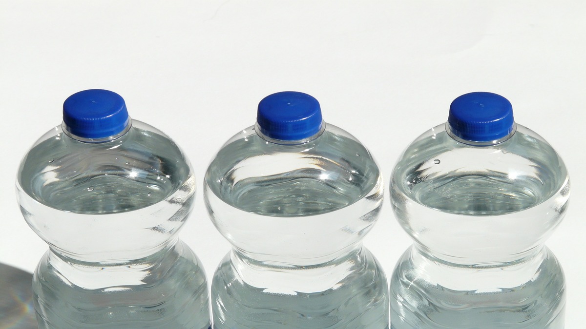 three plastic water bottles